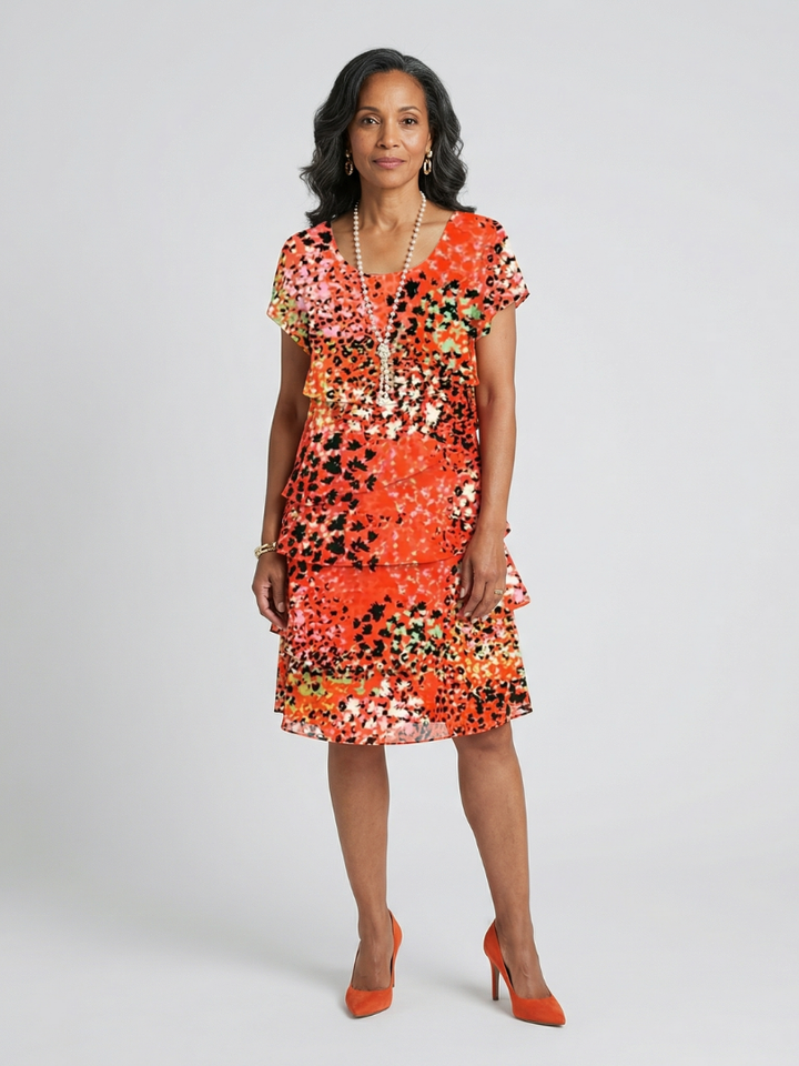 Orange Evania™ tier knee-length dress by Emma & Rose Cape Town, featuring a flowy, layered design and elegant style.