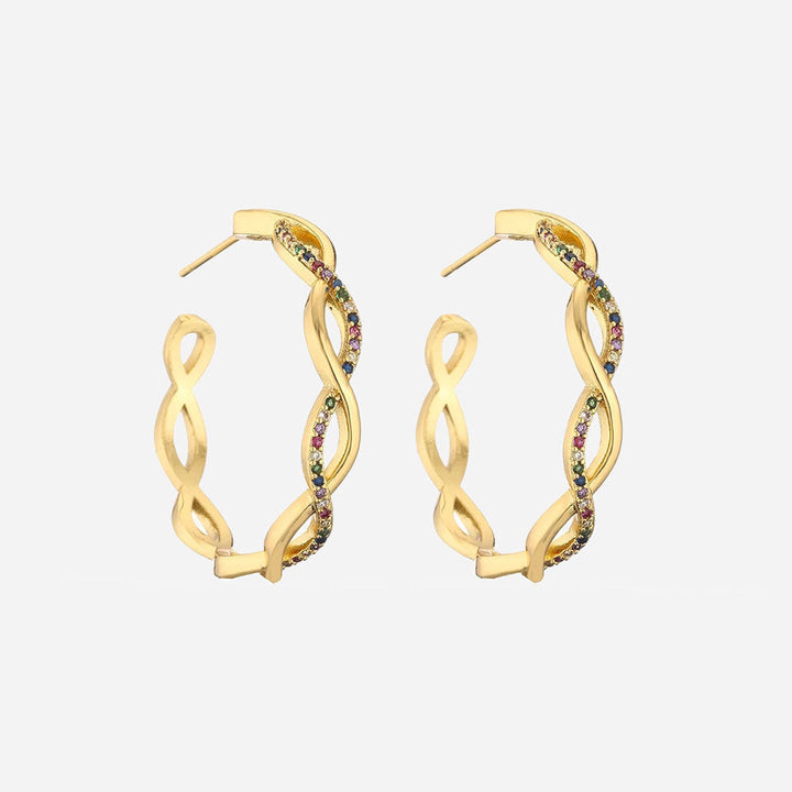 Julenyssa™ wave earrings in 18k gold by Emma & Rose Cape Town, featuring elegant, flowing design and shiny gold finish.