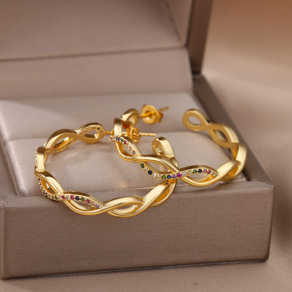 Julenyssa™ wave earrings by Emma & Rose Cape Town in 18k gold, featuring elegant, flowing wave design for stylish wear.