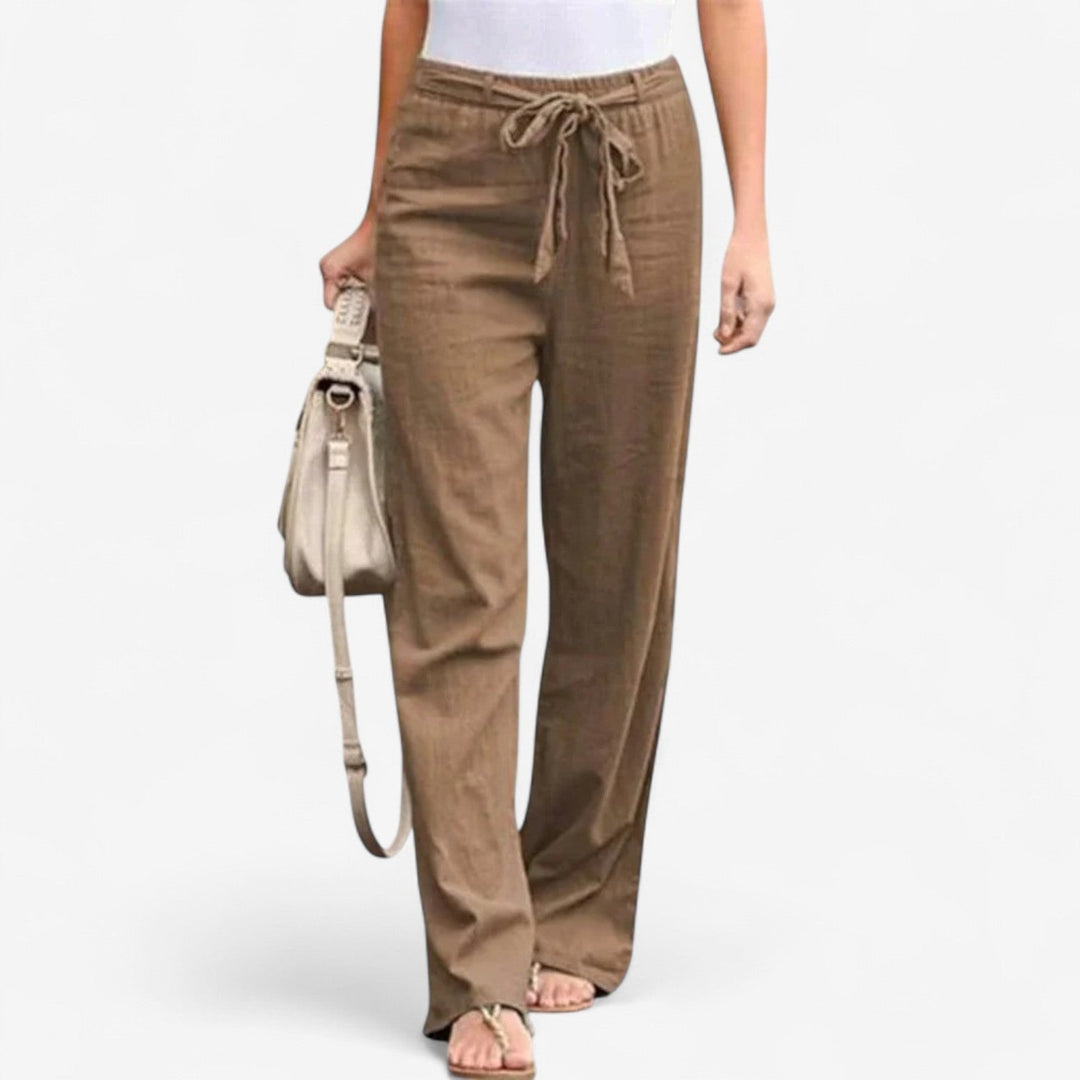 White Arislia™ Chic Trousers by Emma & Rose Cape Town, stylish pants with a tailored fit, shown on a model.