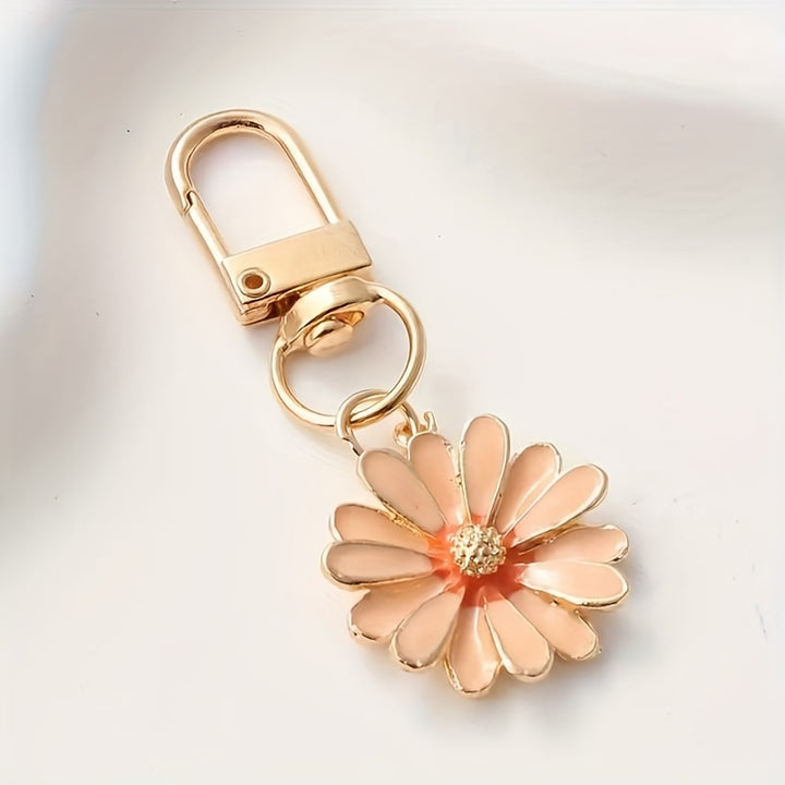 Pink Daisy™ Trendy Backpack Hanger by Emma & Rose Cape Town featuring a floral design and durable metal hook for easy bag hanging.