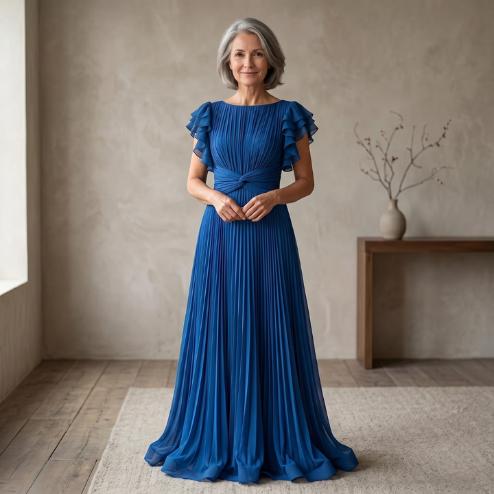 Elegant Abigail™ pleated dress by Emma & Rose Cape Town, featuring flowing fabric and sophisticated design on a mannequin.