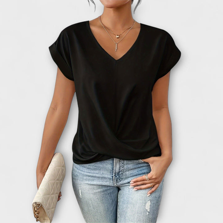 Pink Carlinda™ Elegant V-neck Top by Emma & Rose Cape Town, shown on a hanger with a close-up of the stylish neckline.
