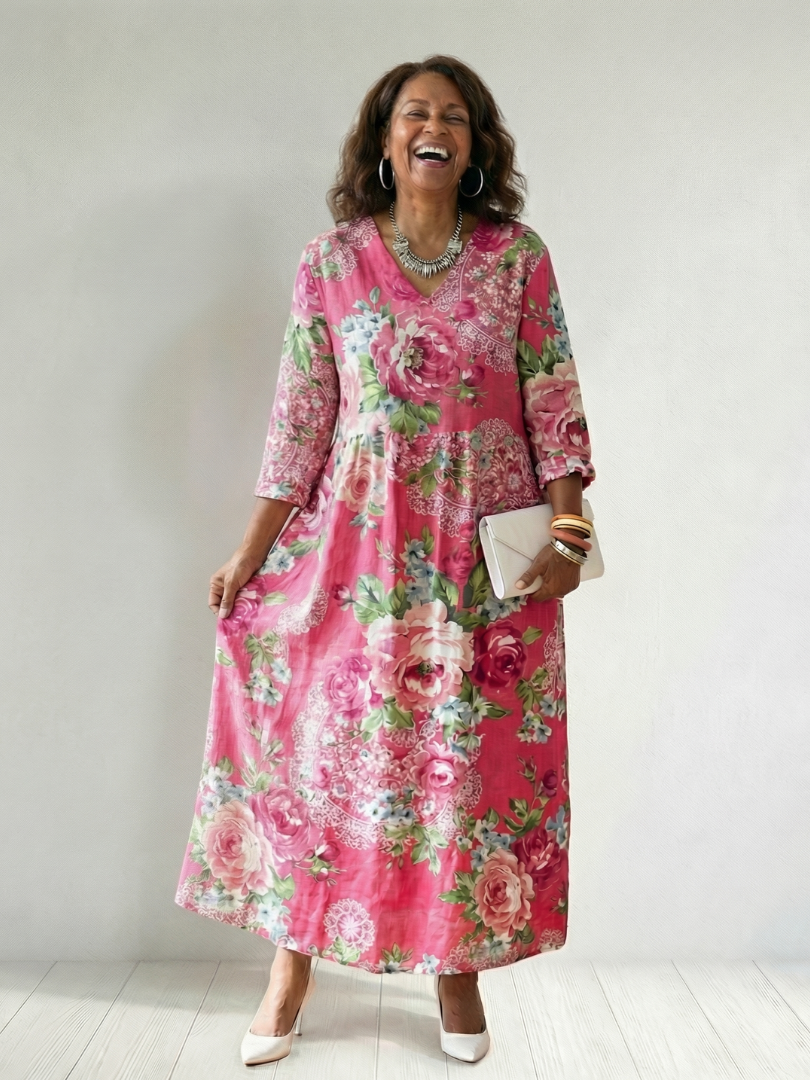 Pink Freya™ Garden Bloom Midi Dress by Emma & Rose Cape Town, featuring floral print and flowing fabric.