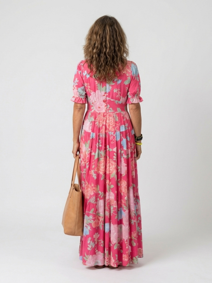 Pink Ione™ neck floral midi dress by Emma & Rose Cape Town, shown on a model with a flowy, elegant design.