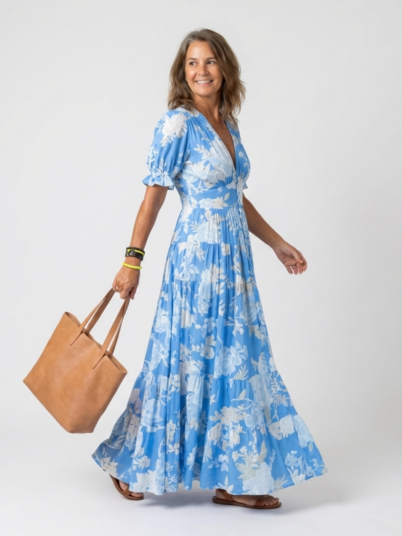 Pink Ione™ neck floral midi dress by Emma & Rose Cape Town, featuring a fitted bodice and flowing skirt with floral pattern.