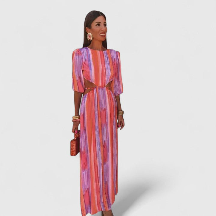 Pink Zeriyahh™ elegant dress by Emma & Rose Cape Town, featuring flowing fabric and stylish design, worn by a model.