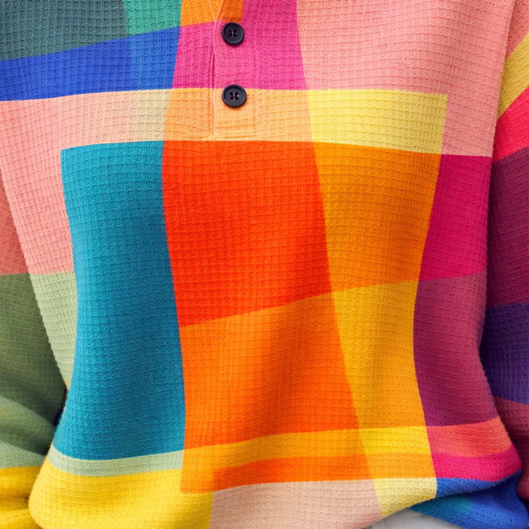 Multicolour Chloé jumper by Emma & Rose Cape Town, featuring vibrant, multicoloured knit fabric and a stylish, cozy design.