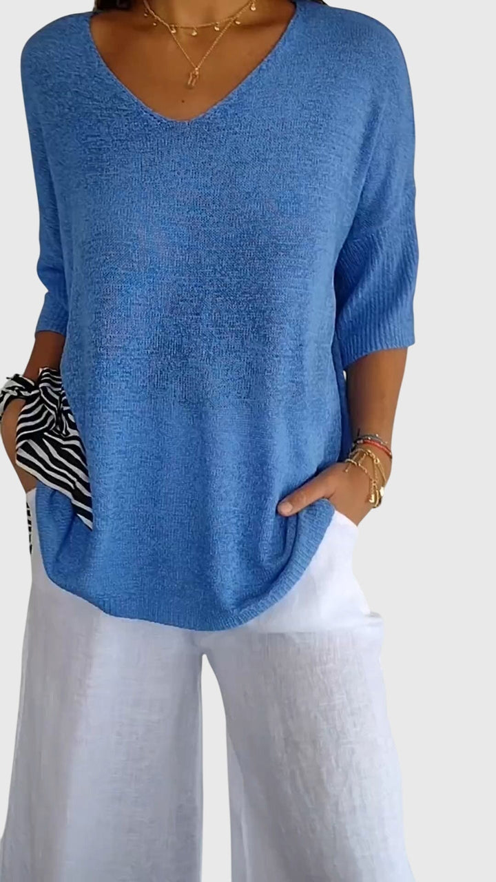 Red Cassandra™ elegant V-neck top by Emma & Rose Cape Town, featuring a stylish fit and soft fabric.