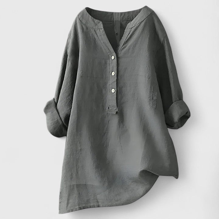 Red Larienne™ elegant button-front shirt by Emma & Rose Cape Town, shown on a model with a classic collar and long sleeves.