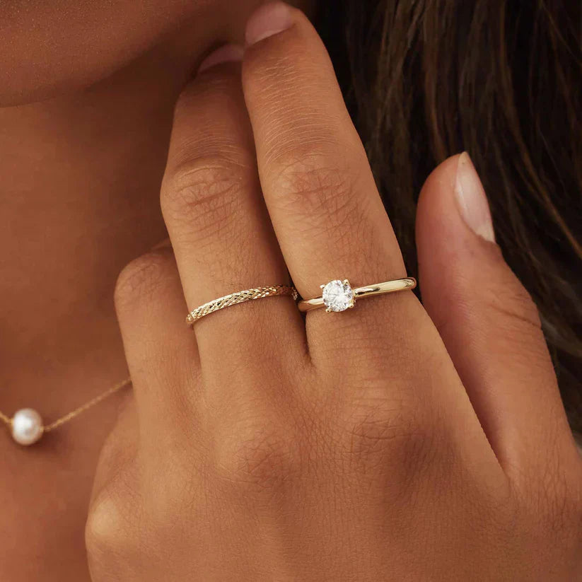 Emma & Rose Cape Town Nerivelle™ 18k gold ring with a sleek, polished design, showcasing fine craftsmanship and luxurious finish.