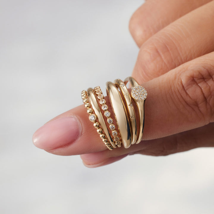 Emma & Rose Cape Town Raquienne™ 18k gold midi ring with a sleek, minimalist design shown on a white background.