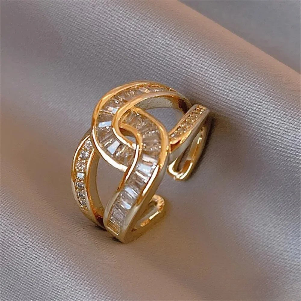 Emma & Rose Cape Town Nadine™ Elegant Knot Ring, silver ring with a delicate knot design on a white background.