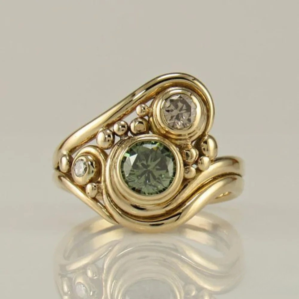 Emma & Rose Cape Town Renske antique ring featuring intricate vintage-style design with a central gemstone and detailed band.