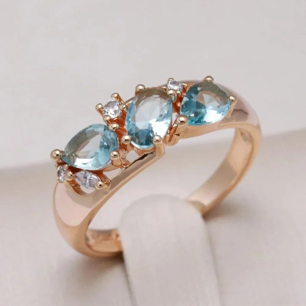Gold™ Emma & Rose Cape Town blue zirconia ring featuring a sleek gold band and sparkling blue zirconia gemstone.