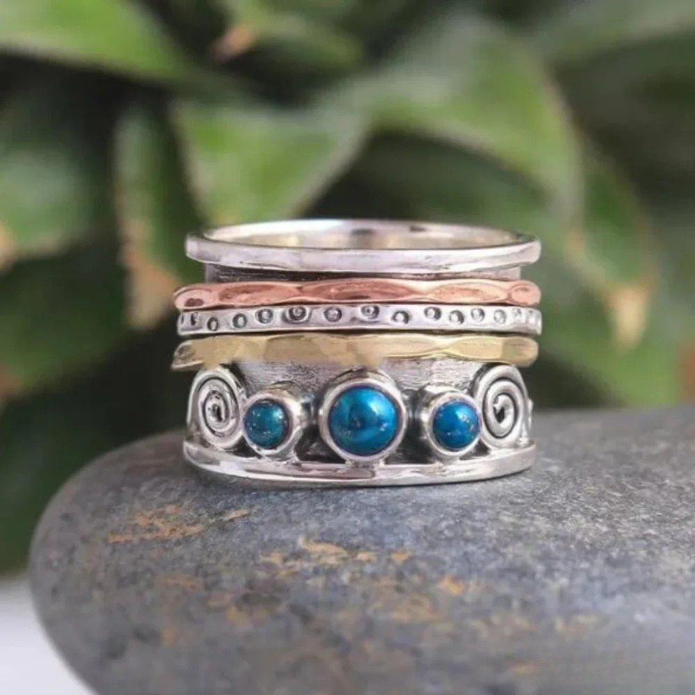 Emma & Rose Cape Town Petra™ Bohemian Sapphire Meditation Ring, gold-tone ring featuring a sapphire gemstone and intricate design.