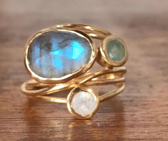 Emma & Rose Cape Town Veronique vintage inset blue ring shown on a finger with intricate design and gemstone details.