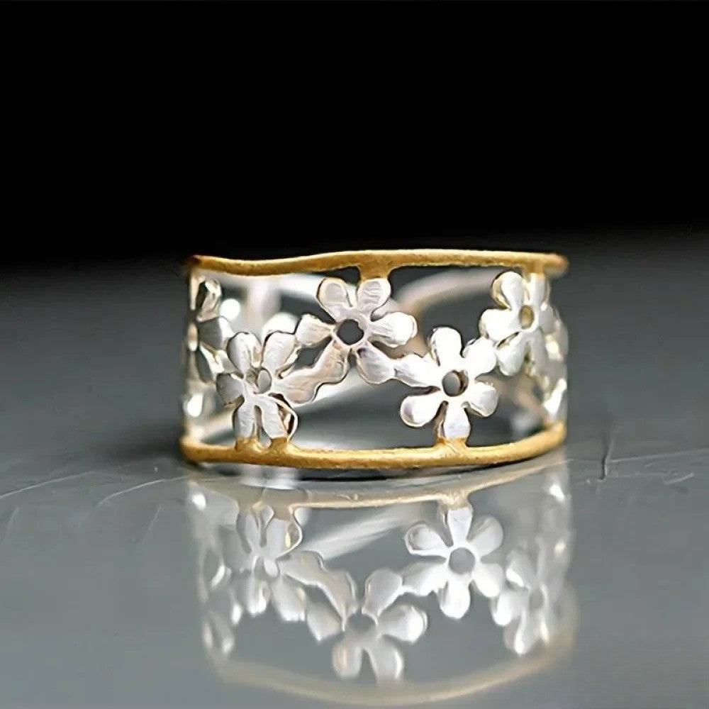 Emma & Rose Cape Town Irregular™ flower ring with a hollow floral pattern, showcasing a unique and artistic jewelry design.