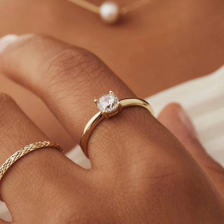 Emma & Rose Cape Town Catherisse™ 18k gold ring with elegant band and intricate design, showcasing fine craftsmanship.