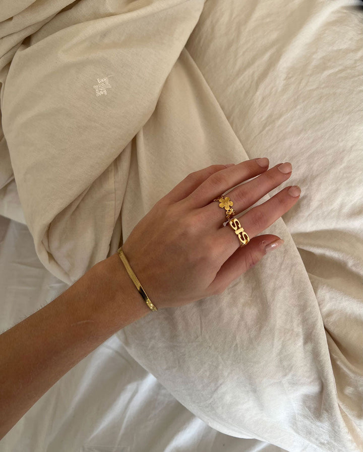 Emma & Rose Cape Town Melianora 18k gold ring with intricate design, showcasing elegant craftsmanship and warm gold tones.
