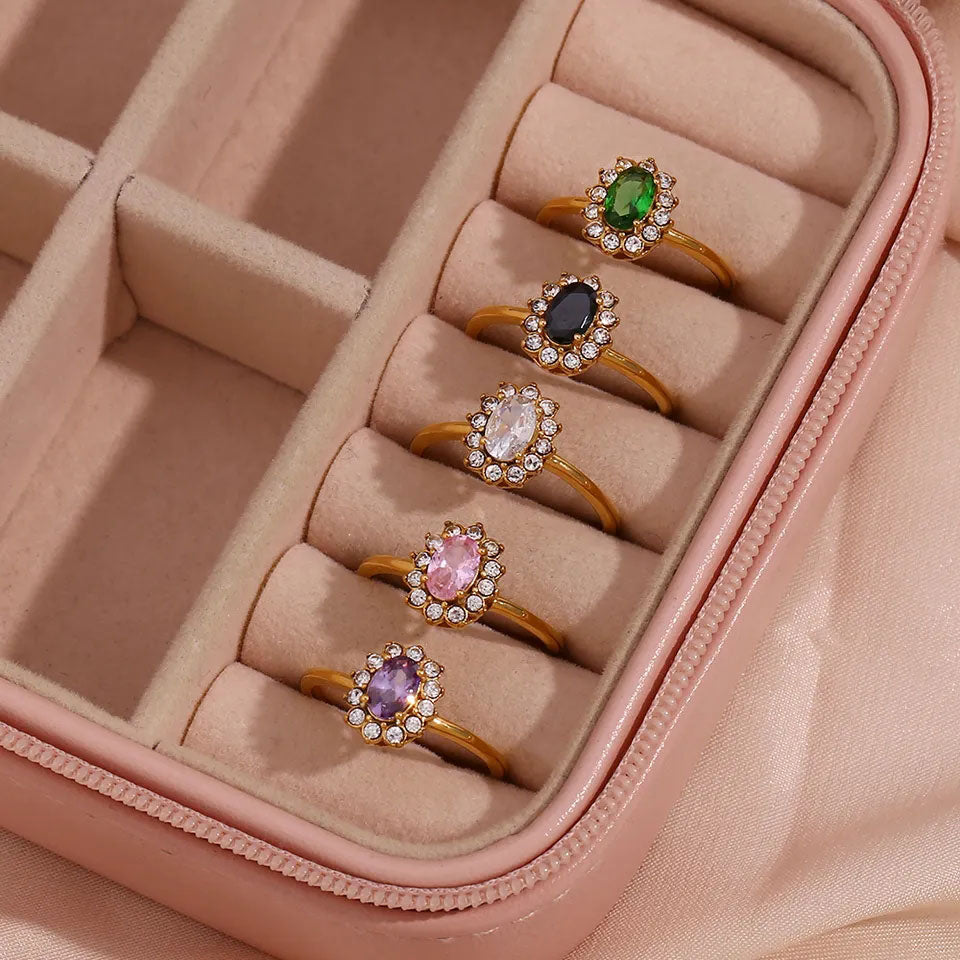 Emma & Rose Cape Town Amaryelle™ green zirconia ring in gold, showcasing an adjustable ring design with sparkling green stones.