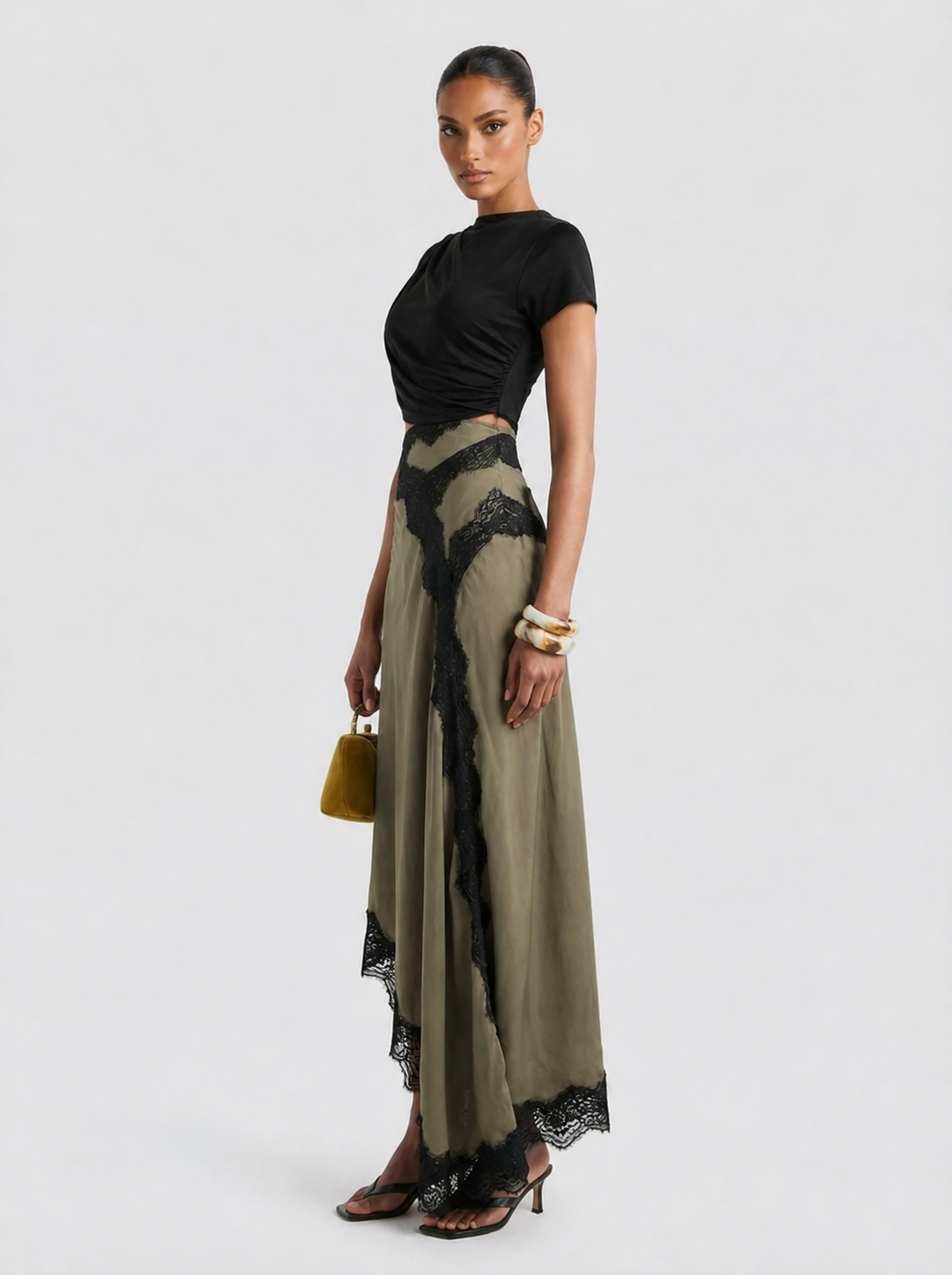 Olive green lace top and maxi skirt set by Emma & Rose Cape Town, featuring intricate lace details and a flowing silhouette.
