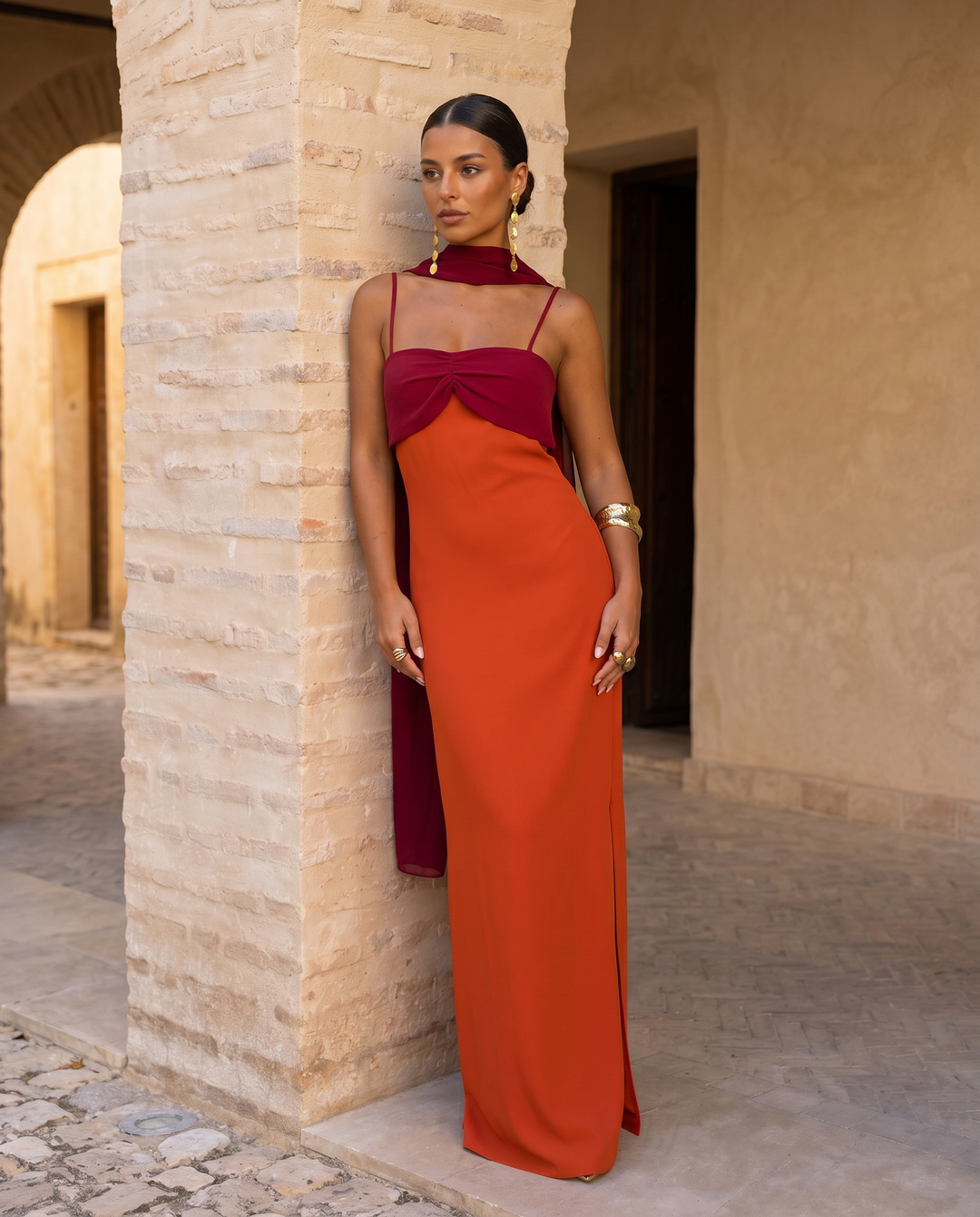 Orange Zahara dress by Emma & Rose Cape Town featuring a red neckline and stylish, flowing fabric.