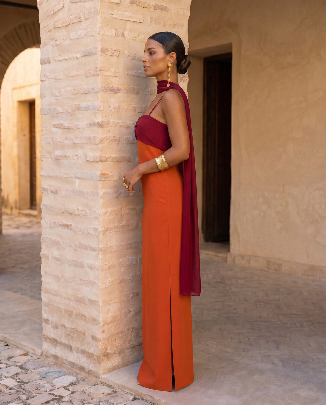 Orange Zahara dress by Emma & Rose Cape Town featuring a red neckline and stylish design.