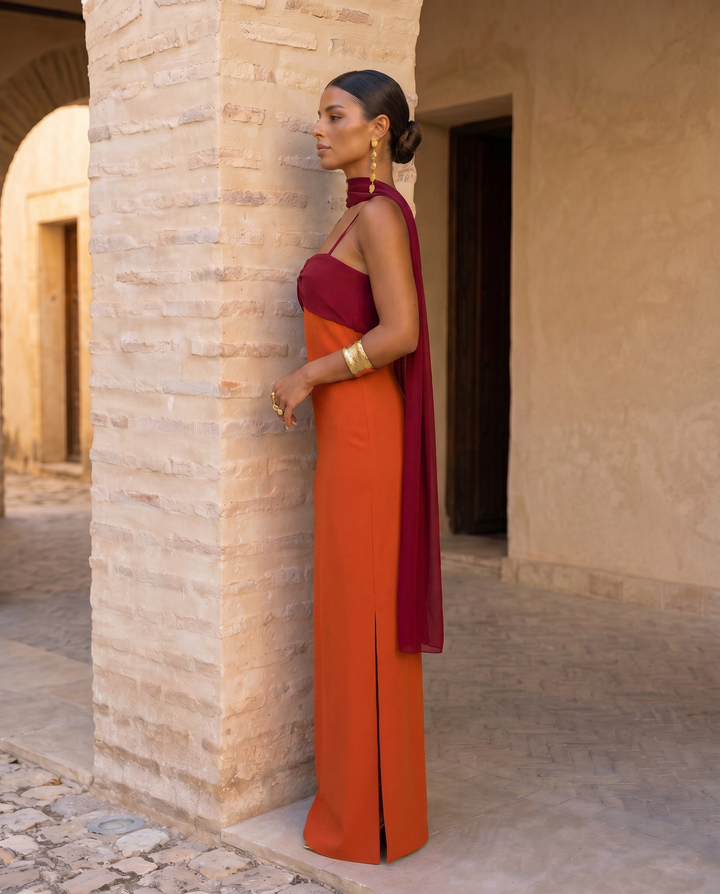 Orange Zahara dress by Emma & Rose Cape Town featuring a red neckline and stylish design.