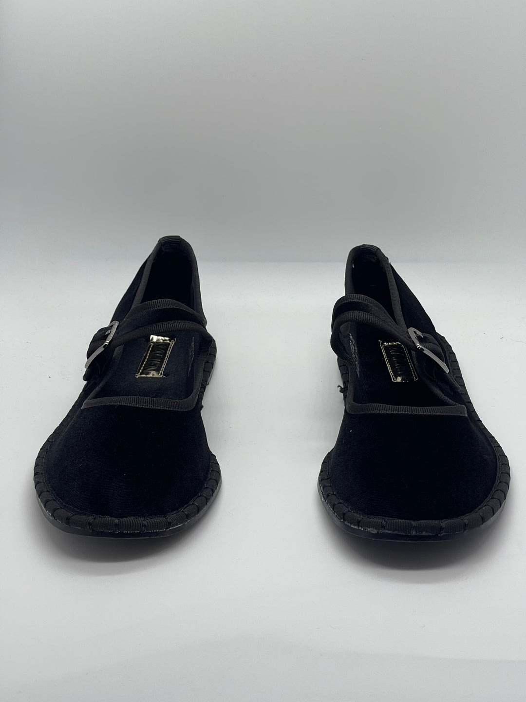 Black Bronwyn™ Friulane strap shoes by Emma & Rose Cape Town, featuring a stylish slip-on design with a comfortable flat sole.
