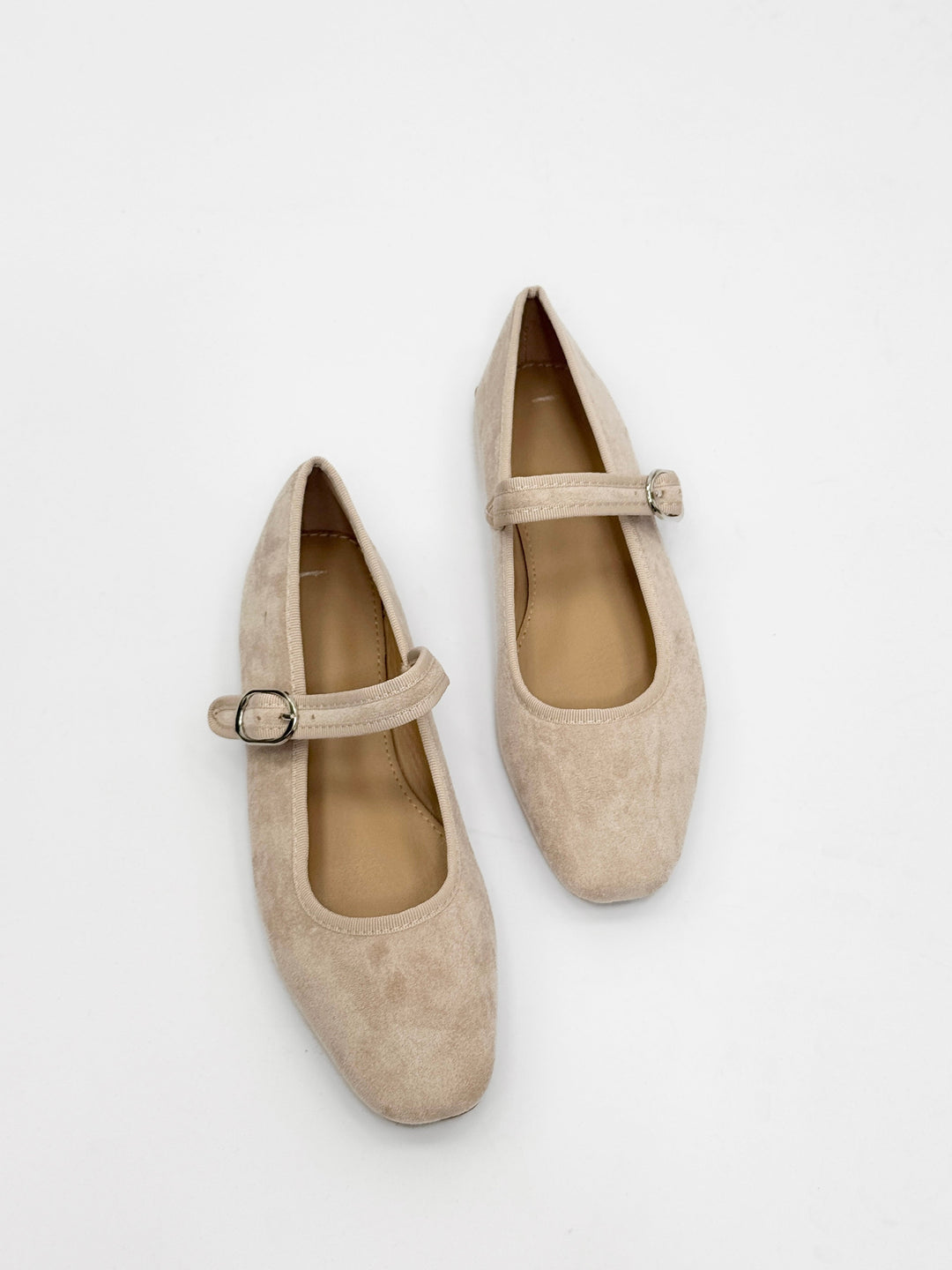 Black Yolande™ ballet flats with strap from Emma & Rose Cape Town, showcasing elegant slip-on footwear with ankle strap detail.