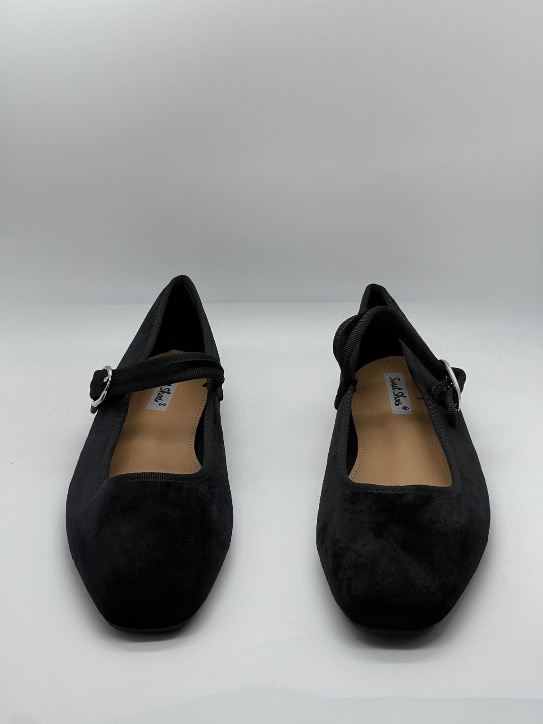 Black Yolande™ ballet flats with strap from Emma & Rose Cape Town, featuring a sleek, comfortable slip-on design.