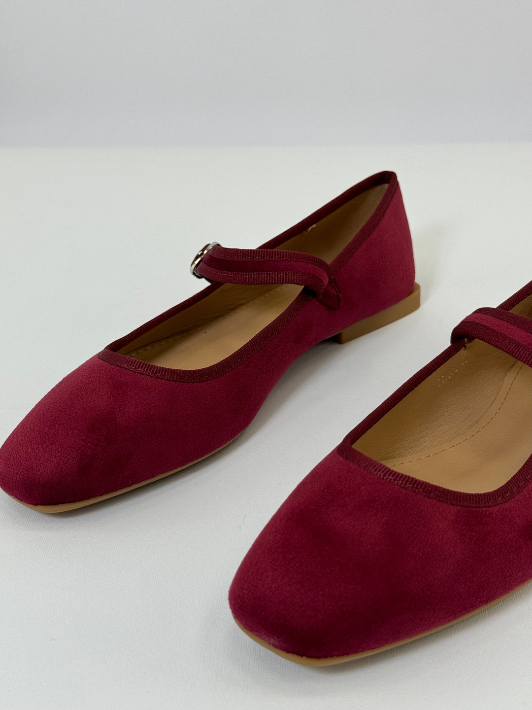 Black Yolande™ ballet flats with strap by Emma & Rose Cape Town, featuring a sleek, comfortable slip-on design.