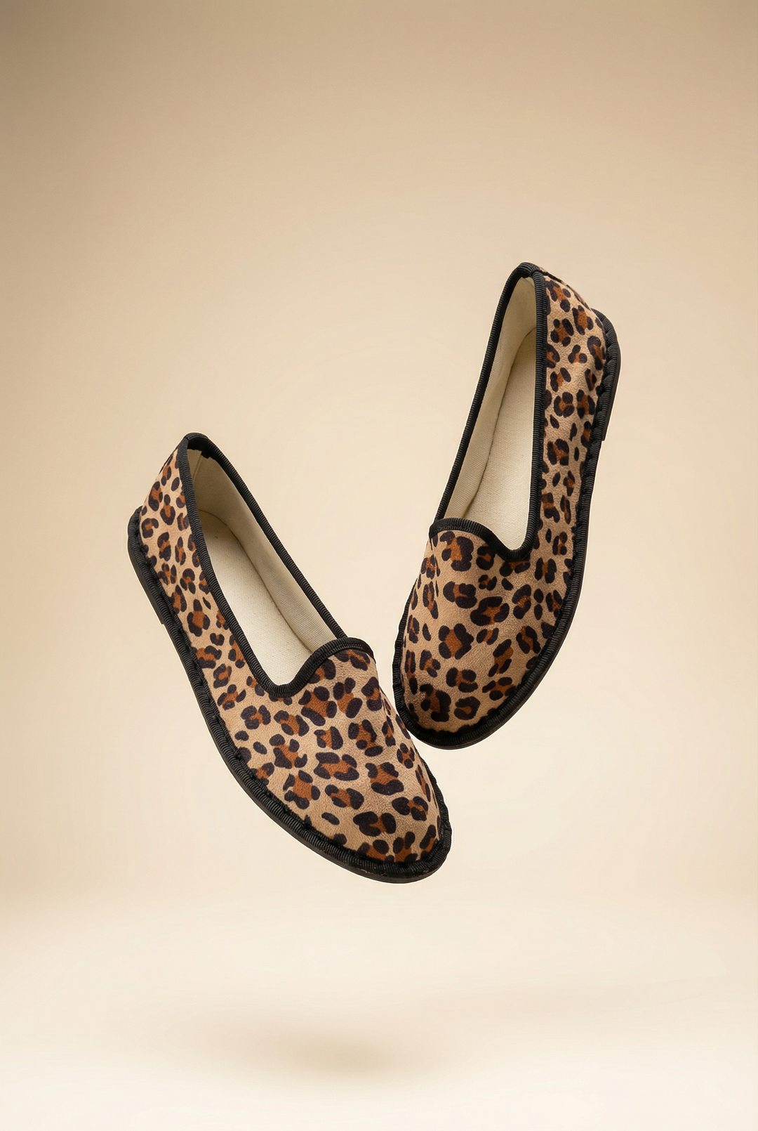 Willemien™ animal print Friulane slippers by Emma & Rose Cape Town featuring soft, luxurious fabrics and a stylish spotted design.