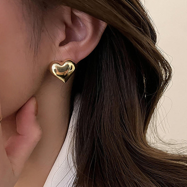 Silver Carien™ Heart Earrings by Emma & Rose Cape Town, elegant jewelry featuring delicate heart-shaped design.