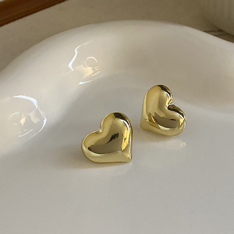 Emma & Rose Cape Town Carien™ silver heart earrings with elegant design, featuring delicate heart-shaped dangles.