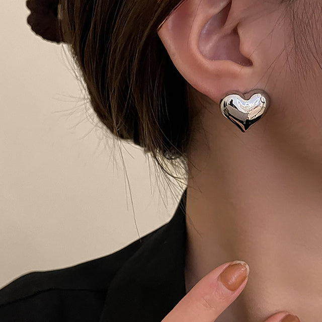 Silver Rina™ Elegant Heart Earrings by Emma & Rose Cape Town, featuring delicate heart-shaped design and intricate silver detailing.
