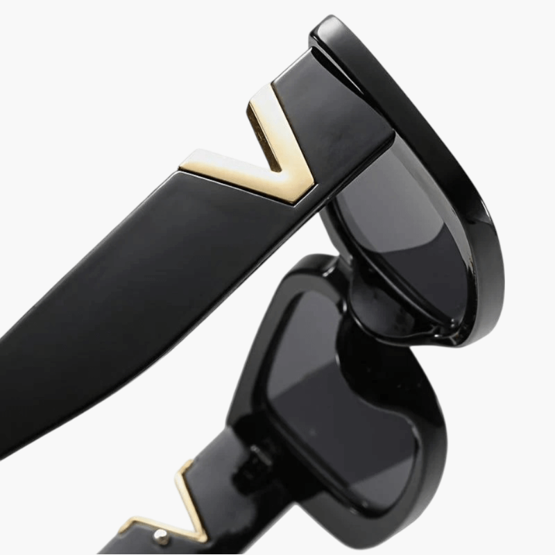Taytum™ Edgy sunglasses by Emma & Rose Cape Town featuring bold black frames and dark tinted lenses.