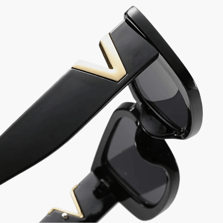 Taytum™ Edgy sunglasses by Emma & Rose Cape Town featuring bold black frames and dark tinted lenses.
