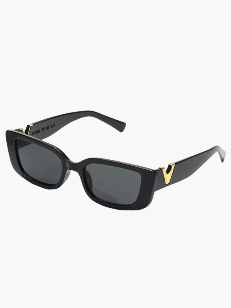 Taytum™ Edgy Sonnenbrille by Emma & Rose Cape Town with bold black frames and tinted lenses, stylish sunglasses for a modern look.