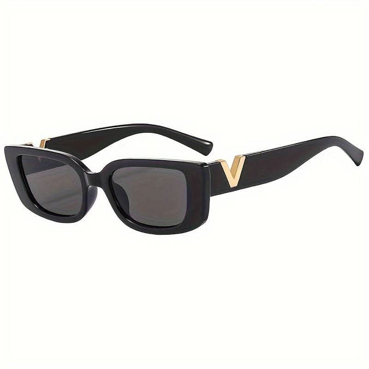 Taytum™ Edgy sunglasses by Emma & Rose Cape Town featuring bold black frames and dark tinted lenses.