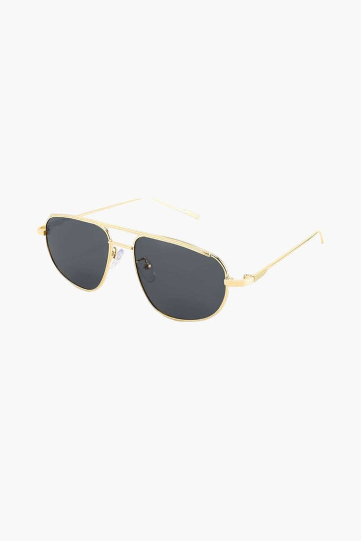 Emma & Rose Cape Town Elliette™ gold and brown refined sunglasses with stylish oval frames and tinted lenses.