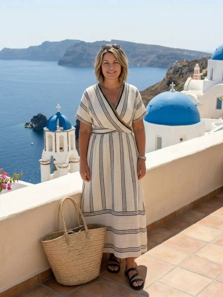 Emma & Rose Cape Town Thalassa wrap waist midi dress with blue and white stripes, featuring a sleek, elegant design.