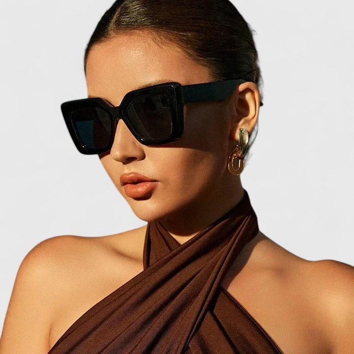Black Raeyana™ stylish sunglasses by Emma & Rose Cape Town with sleek frames and tinted lenses.