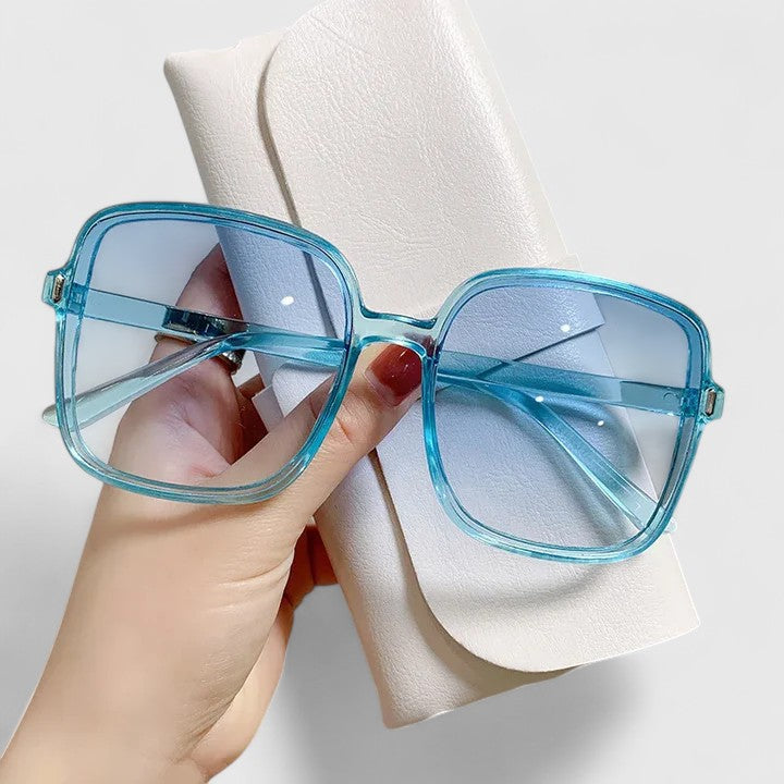 Emma & Rose Cape Town Emalynn elegant sunglasses with white frame and tinted lenses, stylish and sophisticated for sunny days.