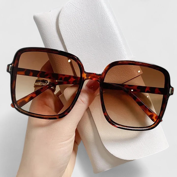 Emma & Rose Cape Town Emalynn elegant sunglasses with white frame and stylish design, showcasing the sophisticated eyewear.