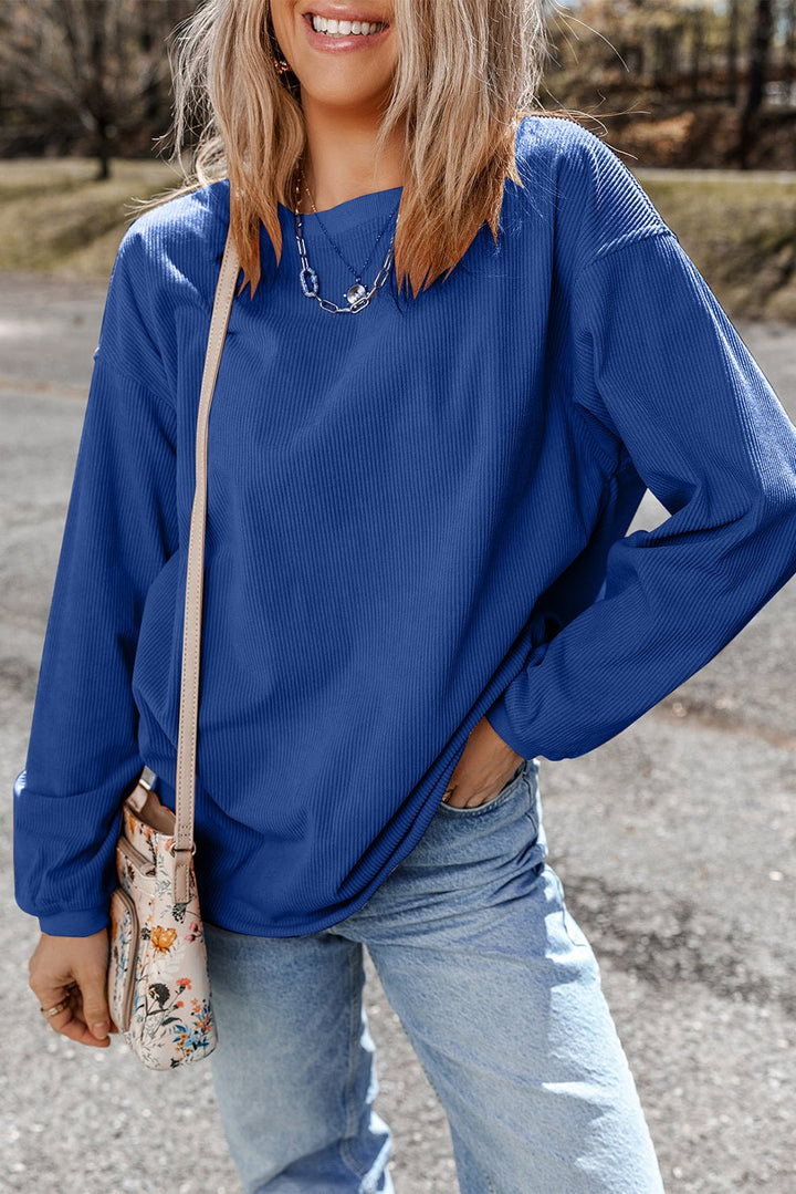 Apricot drop shoulder rib knit oversized sweatshirt from Emma & Rose Cape Town, cozy and stylish for casual wear.