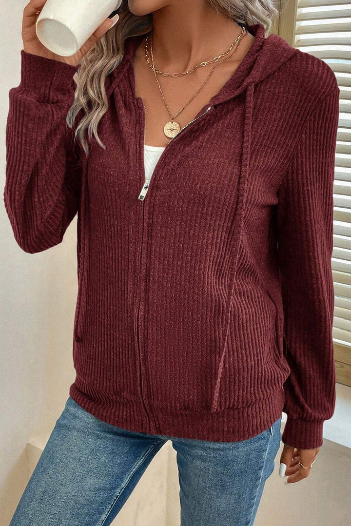 Red Dahlia ribbed zip front drawstring hoodie by Emma & Rose Cape Town, featuring a cozy sweatshirt design with a hood and front pockets.