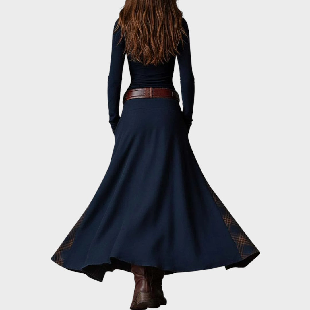 Dark blue Ivana Extravagant Dress by Emma & Rose Cape Town, showing elegant sleeveless design and flowing fabric.