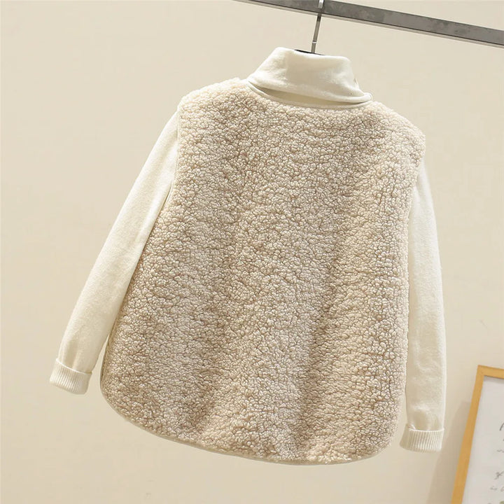 Beige Faye™ vest by Emma & Rose Cape Town featuring soft, luxurious fabrics and a stylish sleeveless design.